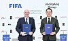 FIFA President Gianni Infantino, left, poses for a photo with JoongAng Group Vice Chairman Hong Jeong-do at the JTBC headquarters in western Seoul on Tuesday. [YONHAP]