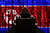 An illustration of a North Korean hacker at a computer, with a background of binary code. [GETTY IMAGES]