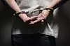 A man in handcuffs [GETTY IMAGES]