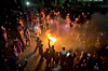This frame grab from footage circulating on social media shows protesters dancing and cheering around a bonfire as they take to the streets despite an intensifying crackdown in Tehran, Iran, on Jan. 9, as the Islamic Republic remains cut off from the rest of the world. [AP/YONHAP]