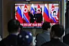 A television screen shows a file image of North Korean leader Kim Jong-un, right, and Russian President Vladimir Putin in Pyongyang, during a news program at Seoul Station in Jongno District, central Seoul, on April 28. [AP/YONHAP]