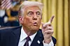 U.S. President Donald Trump signs numerous executive orders on the first day of his presidency on Jan. 20. [EPA/YONHAP]