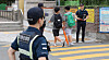 Police patrol around an elementary school in Daegu amid an increase in attempted kidnapping cases across the country on Sept. 12. [YONHAP]