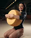 Italian gymnast Giorgia Villa poses with a wheel of parmesan in a photo posted to her personal Instagram account. [SCREEN CAPTURE]