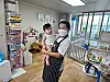 Filipino domestic caregiver Mary Grace, 36, poses for a photo with a child on Tuesday at a household where she began working under the foreign domestic caregiver scheme that launched the same day. [SEOUL METROPOLITAN GOVERNMENT]
