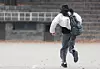 A test-taker runs to Ewha Girls' Foreign Language High School in Jung District, central Seoul, for the 2026 College Scholastic Ability Test (CSAT) on Nov. 13. [YONHAP]