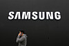 A person walks by a logo of Samsung Electronics at an exhibition hall for the Asia-Pacific Economic Cooperation (APEC) in Gyeongju, North Gyeongsang, on Oct. 30. [AP/YONHAP]