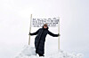 A protester holds a banner outside Katuaq Cultural Center in Nuuk, Greenland, March 28, 2025. [REUTERS/YONHAP]