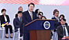 President Yoon Suk Yeol gives congratulatory remarks at the opening of a small business owners' convention at the Kintex exhibition hall in Goyang, Gyeonggi, on Thursday. [YONHAP]
