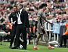 Tottenham Hotspur's Son Heung-min, right, walks past manager Ange Postecoglou after being substituted during a Premier League match against Newcastle United at St. James Park in Newcastle, England on Saturday. [REUTERS/YONHAP]