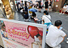 Visitors wait for a shop in Myeongdong, central Seoul, to open on Aug. 1. [YONHAP]