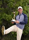 Rory McIlroy shows how the sole of his shoes matches the winner's trophy after winning The Players Championship on The Stadium Course at TPC Sawgrass on March 17, 2019 in Ponte Vedra Beach, Florida. [GETTY IMAGES]