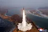 A photo released by the official North Korean Central News Agency on Jan. 6 shows the launch of an intermediate-range ballistic missile with a hypersonic warhead as payload at an undisclosed location in North Korea. [EPA/YONHAP]