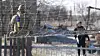 Ukrainian national police officers stand near an antidrone net during the evacuation of residents from the Tavriiske and Yurkivka villages in Ukraine's Zaporizhzhia region amid Russia's attack on Ukraine, in this screengrab from a video from Feb. 3. [REUTERS/YONHAP]