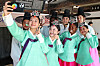 International students wearing hanbok, or Korean traditional dress, take selfies during a Coming of Age Day event held at a traditional house in Yeungnam University in Gyeongsan, North Gyeongsang, on Friday. The Coming of Age Day fell on Monday this year. [NEWS1]