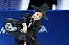 Korean figure skater Lee Hae-in performs in a traditional Korean overcoat and hat during the Exhibition Gala of the 2026 Milan-Cortina Winter Olympics at the Milano Ice Skating Arena in Milan on Feb. 21. [YONHAP]