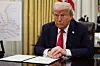 U.S. President Donald Trump prepares to sign an executive order related to the U.S. live entertainment ticketing industry in the Oval Office at the White House in Washington, D.C., March 31. [REUTERS/YONHAP]