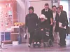 Ko Yong-hui, the late mother of North Korean leader Kim Jong-un, is seen being assisted by an aide as she moves in a wheelchair as her health rapidly deteriorated due to breast cancer. [BUNGEI SHUNJU]