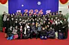 North Korean leader Kim Jong-un, center, poses for a commemorative photo with family members of commanders from overseas operations units attending the “2026 New Year celebratory performance” at the May Day Stadium in Pyongyang on Jan. 1. [RODONG SINMUN]
