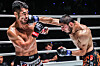 Korea's Ok Rae-yoon, left, takes a punch from Turkey's Alibeg Rasulov in Bangkok, Thailand on Saturday. [ONE CHAMPIONSHIP]