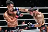Korea's Ok Rae-yoon, left, takes a punch from Turkey's Alibeg Rasulov in Bangkok, Thailand on Saturday. [ONE CHAMPIONSHIP]