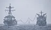 The USS William P. Lawrence, left. and the ROKS Daecheong conduct a replenishment drill in the East Sea on May 9. [NEWS1]