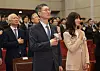 Constitutional Court Acting Chief Justice Moon Hyung-bae and his wife Lee Kyung-ah pledge allegiance to the flag before his and fellow justice Lee Mi-son's leaving ceremony at the court in Jongno District, central Seoul on April 18. [YONHAP]