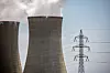 Pylons carry high voltage electricity cables past cooling towers operating at the Dukovany nuclear power plant operated by CEZ AS, near the village of Dukovany, Czech Republic, on May 12. [EPA/YONHAP]