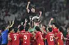 Vietnam head coach Kim Sang-sik of Korea celebrates with the Vietnam U-23 soccer team after defeating Indonesia during their final Asean U-23 Championship soccer match at Gelora Bung Karno Main Stadium in Jakarta, Indonesia on July 29, 2025. [AP/YONHAP]