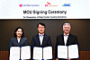 Nam Jae-in, left, head of green growth business at SK Enmove; Lee Jae-sung, center, head of the energy solution division at LG Electronics; and Peter Pollin, CEO of GRC, pose for a photo after signing a memorandum of understanding (MOU) at LG Electronics' production facility in Pyeongtaek, south of Seoul, on Oct. 27.  [LG ELECTRONICS]