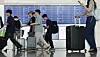 Travelers move around Incheon International Airport's Terminal 1 on Aug. 3. [YONHAP]