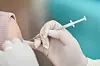 A woman receives a booster dose of the Pfizer-BioNTech vaccine against the coronavirus disease (Covid-19), ahead of brace of an influx of Chinese tourists as Covid-19 restrictions are dismantled, at the Police Hospital in Bangkok, Thailand, on January 5, 2023. [REUTERS/YONHAP]