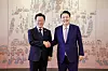 President Yoon Suk Yeol, right, shakes hands with Democratic Party leader Lee Jae-myung in their first official talks at the presidential office in Yongsan District, central Seoul, on April 29. [YONHAP]