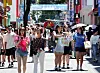 Visitors walk around Myeong-dong, a shopping district in central Seoul, on July 27. [YONHAP]