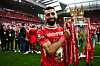 Liverpool striker Mohamed Salah celebrates with the Premier League trophy at the end of the English Premier League football match between Liverpool and Crystal Palace at Anfield in Liverpool on May 25. [AFP/YONHAP]