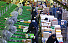 Workers classify parcels at a logistics center in southern Seoul. [YONHAP]