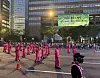 A parade to celebrate the grand finale of Netflix's global hit series ″Squid Game″ (2021-) was held in central Seoul on June 28. The image features a marching band wearing the show's iconic Pink Guard costume. [KIM JI-YE]