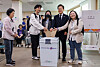 Democratic Party presidential candidate Lee Jae-myung, second to right, votes with young supporters at the Sinchon-dong Community Center in Seodaemun District, western Seoul, on May 29, the first day of advance voting for the 21st presidential election. [YONHAP]