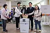 Democratic Party presidential candidate Lee Jae-myung, second to right, votes with young supporters at the Sinchon-dong Community Center in Seodaemun District, western Seoul, on May 29, the first day of advance voting for the 21st presidential election. [YONHAP]