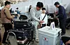A family casts ballots at Incheon International Airport before departing the country on May 29, the first day of advance voting for the 21st presidential election. [NEWS1]