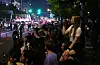People gather in central Seoul to watch a parade celebrating the grand finale of Netflix’s ″Squid Game″ (2021-) on June 28. [YONHAP]