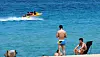 With temperatures soaring above 30 degrees Celsius (86 degrees Fahrenheit), people at Gyeongpo Beach in Gangneung, Gangwon, bask under the blazing sun and enjoy boat rides, embracing the summer heat. [YONHAP]