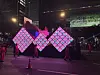 A parade to celebrate the grand finale of Netflix's global hit series ″Squid Game″ (2021-) was held in central Seoul on June 28. The image features a miniature replica of the show’s iconic staircases, along with a screen displaying the faces of the players. [KIM JI-YE]