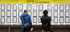 Job seekers scan for job openings at a center in Mapo District in western Seoul on Wednesday. [NEWS1]