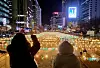 Visitors watch the lanterns lit up along Cheonggye Stream in downtown Seoul on Dec. 13. The lantern festival will be held as part of the capital's winter festival dubbed Seoul Winter Festa 2023 through Jan.21. [NEWS1]
