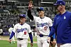Los Angeles Dodgers' designated hitter Shohei Ohtani, center, and pitcher Yoshinobu Yamamoto, left, walk together at the start of an exhibition game between the Los Angeles Dodgers and Kiwoom Heroes at Gocheok Sky Dome in western Seoul on Sunday. [AP/YONHAP]