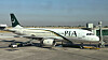 A view of a Pakistan International Airlines passenger plane, taken through a glass panel, at Islamabad International Airport in Pakistan Oct. 3, 2023. [REUTERS/YONHAP]