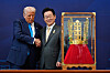 U.S. President Donald Trump shakes hands with Korean President Lee Jae Myung as he receives a gift of a gold crown and an award of the Grand Order of Mugunghwa, not seen, during a high honor ceremony at the Gyeongju National Museum in Gyeongju, North Gyeongsang, Oct. 29. [AP/YONHAP]