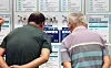 Job seekers look at notices posted at a job fair in Suwon, Gyeonggi, on July 9. [NEWS1]