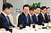 President Lee Jae Myung, second from left, speaks at a luncheon meeting with research center heads at security firms at the Yongsan presidential office in central Seoul on Sept. 18. [JOINT PRESS CORPS]